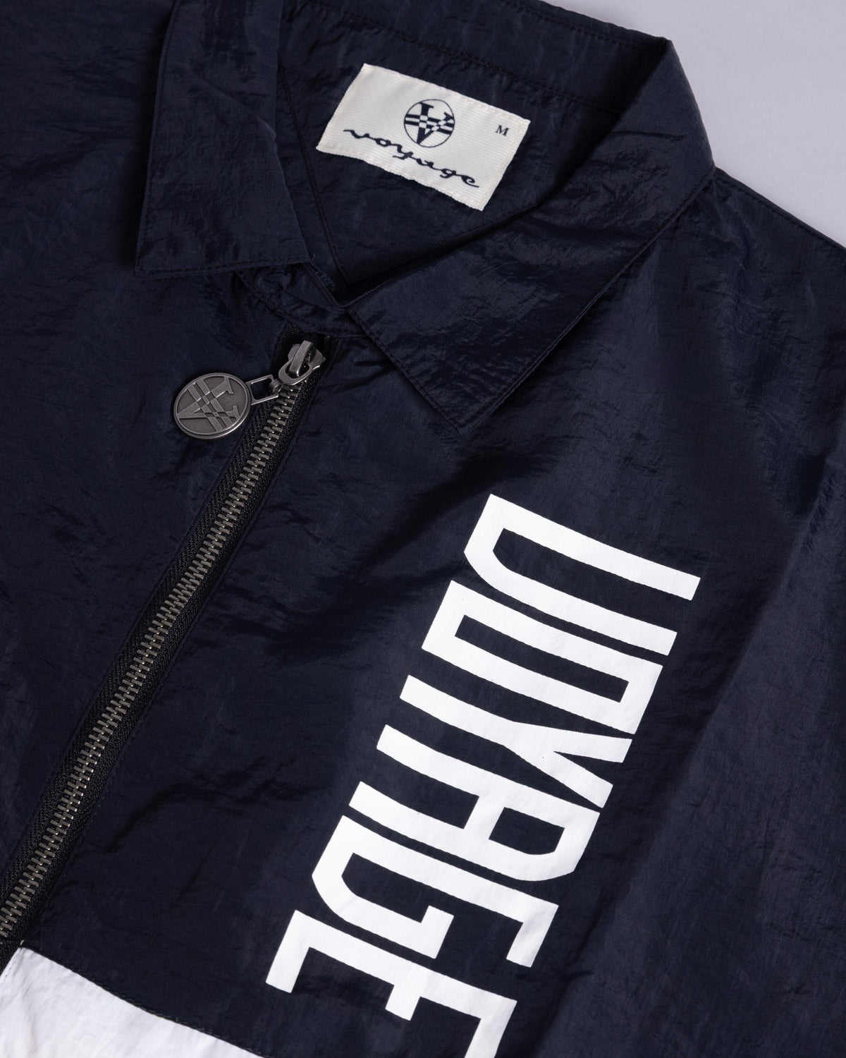 Voyage Sports Jacket Navy/White, close-up