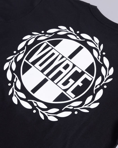 Voyage Emblem Tee Black, close-up detail
