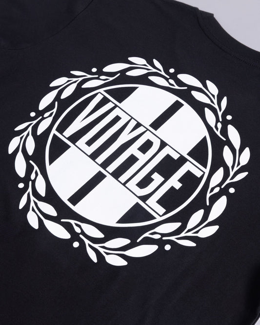 Voyage Emblem Tee Black, close-up detail
